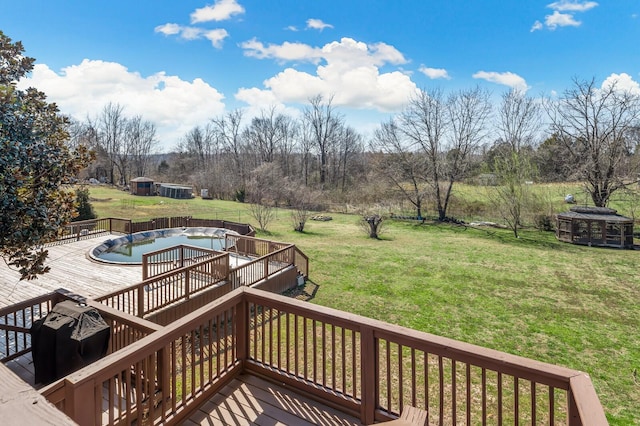 deck with area for grilling and a lawn