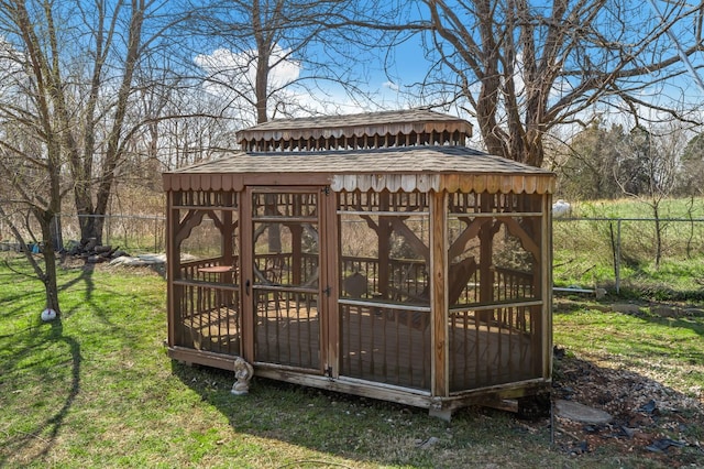 view of outdoor structure with an outdoor structure and fence