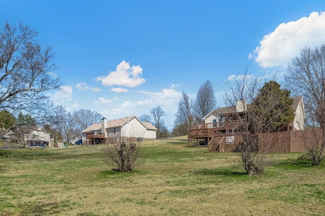 view of yard with a deck and stairway