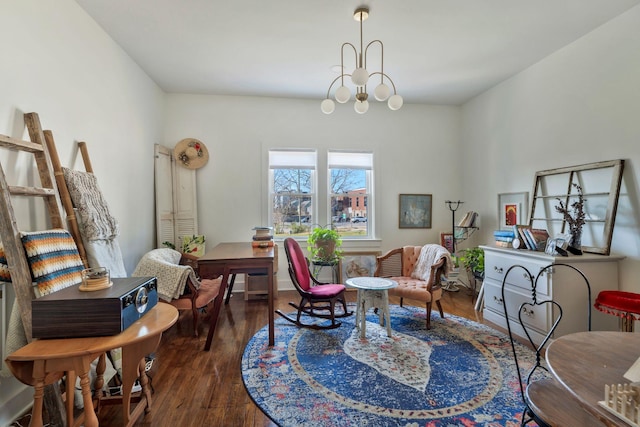 sitting room featuring an inviting chandelier and wood finished floors