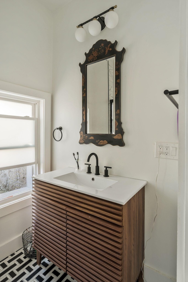 bathroom featuring vanity and baseboards