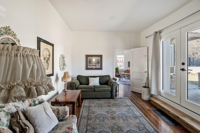 living area featuring dark wood-type flooring and french doors