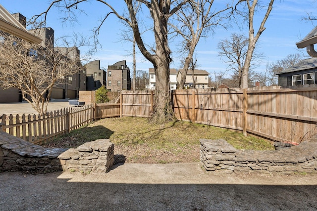 view of yard featuring a residential view and fence private yard