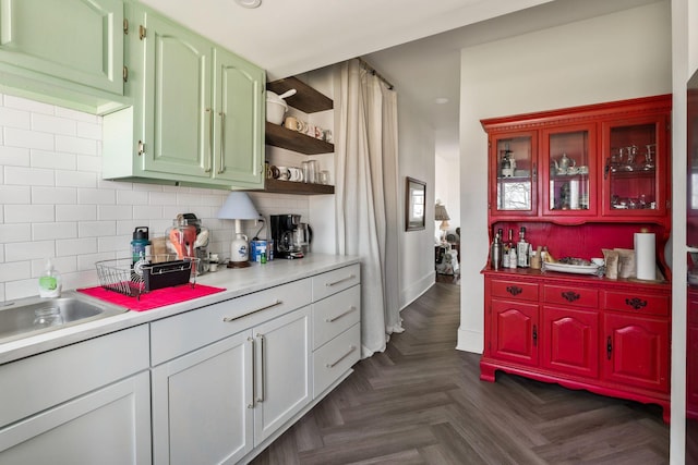 kitchen featuring light countertops, tasteful backsplash, and open shelves