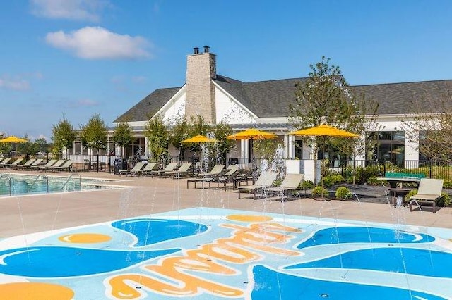 view of home's community with a patio and fence