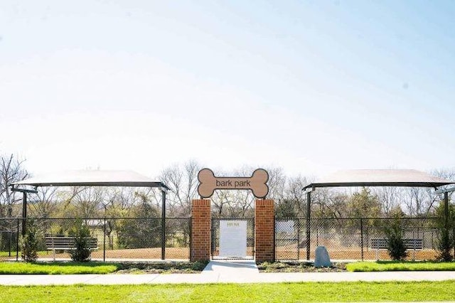 view of gate featuring fence