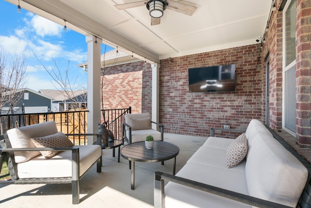 view of patio featuring an outdoor living space and ceiling fan