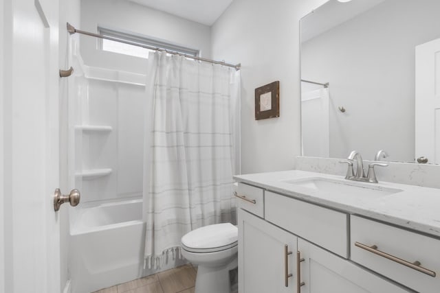 full bathroom with vanity, toilet, and shower / tub combo