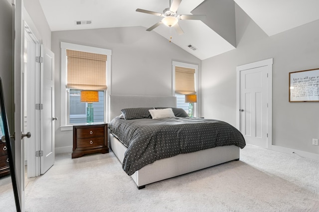 carpeted bedroom with vaulted ceiling, baseboards, visible vents, and ceiling fan