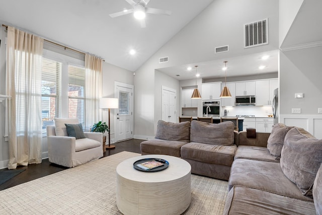 living room featuring dark wood finished floors and visible vents