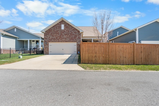 view of front of property with brick siding, an attached garage, concrete driveway, and fence