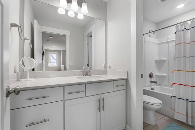 full bath featuring vanity, toilet, and shower / bath combo