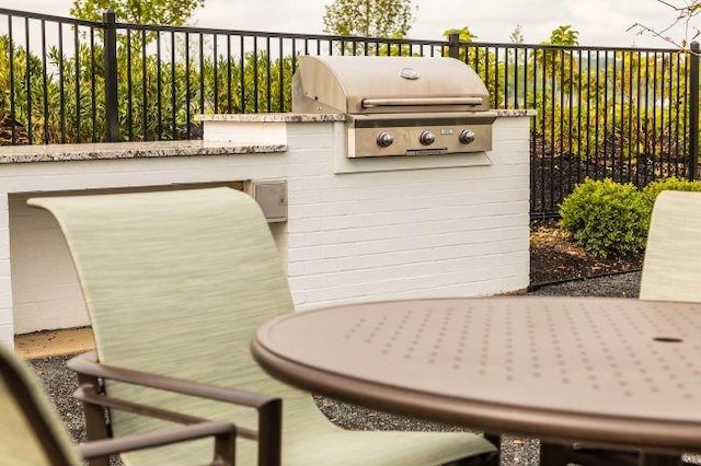 view of patio / terrace featuring grilling area, area for grilling, and fence