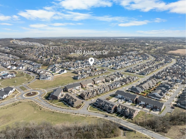 birds eye view of property with a residential view