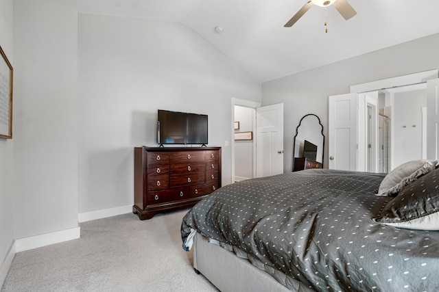 bedroom featuring baseboards, lofted ceiling, carpet, and a ceiling fan