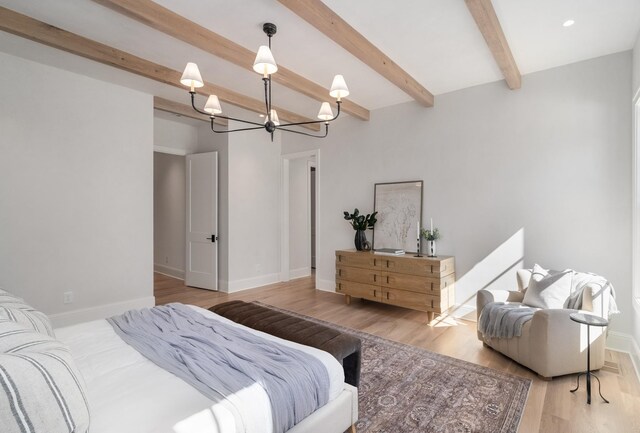 bedroom featuring beamed ceiling, baseboards, a notable chandelier, and wood finished floors