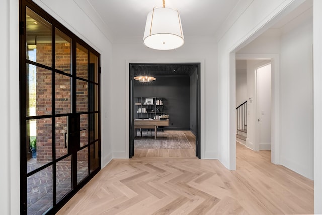 hall with stairs, baseboards, and ornamental molding