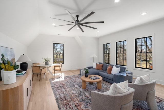 living area with light wood finished floors, recessed lighting, a ceiling fan, and baseboards