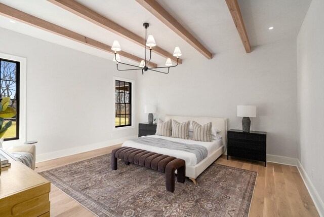 bedroom with beamed ceiling, a notable chandelier, recessed lighting, light wood finished floors, and baseboards