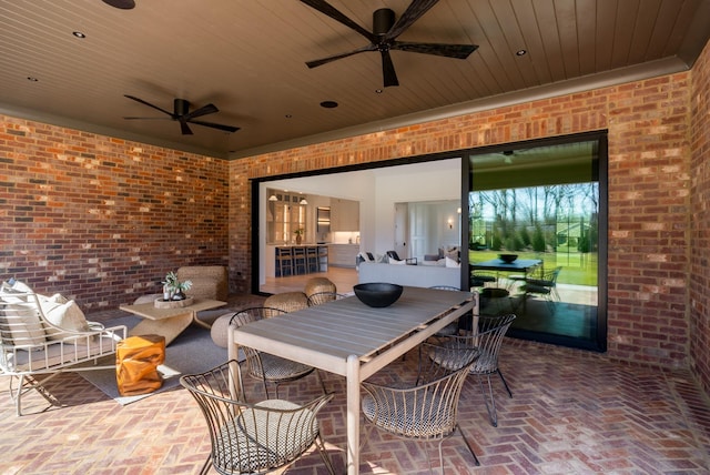 view of patio featuring outdoor dining space, outdoor lounge area, and a ceiling fan