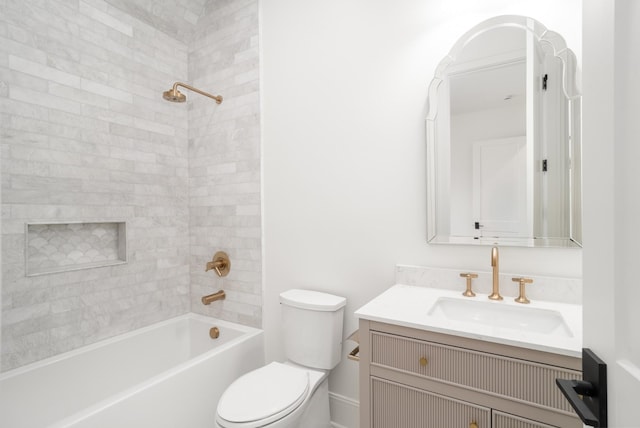 bathroom with vanity, shower / bathing tub combination, and toilet