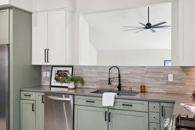 kitchen with dark countertops, tasteful backsplash, and a sink