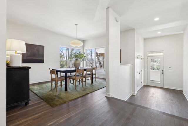 dining room featuring recessed lighting, plenty of natural light, dark wood-style floors, and baseboards