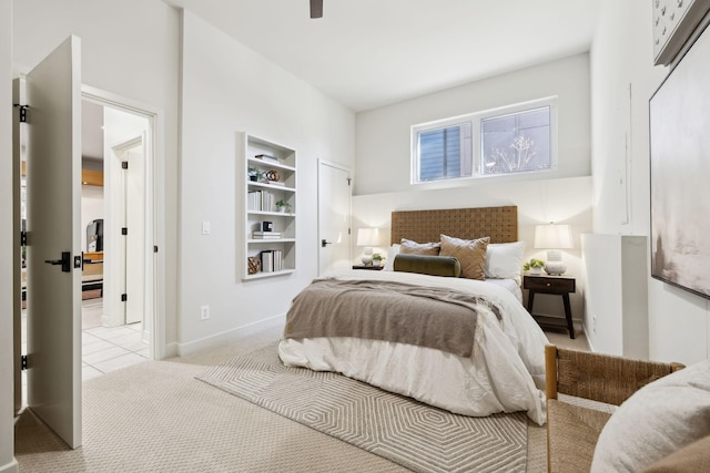 bedroom with light carpet and a ceiling fan