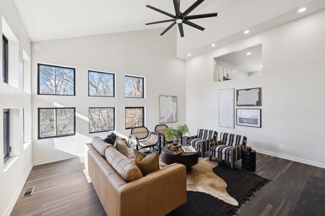 living room featuring visible vents, high vaulted ceiling, dark wood-style floors, recessed lighting, and baseboards