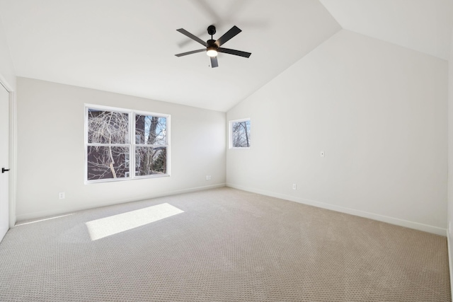 unfurnished room with light carpet, a ceiling fan, and vaulted ceiling