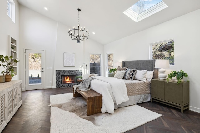 bedroom with access to exterior, baseboards, recessed lighting, a fireplace, and high vaulted ceiling