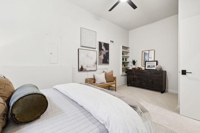 carpeted bedroom with electric panel, visible vents, ceiling fan, and baseboards