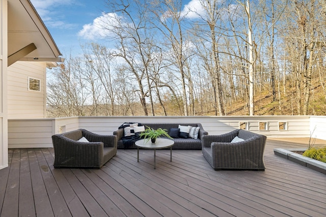 wooden terrace with an outdoor hangout area