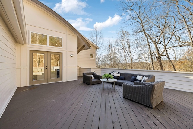 wooden terrace with an outdoor living space and french doors