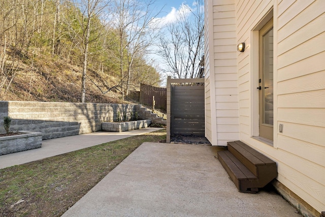 view of patio / terrace featuring entry steps and fence