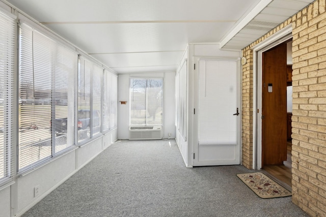 unfurnished sunroom with cooling unit