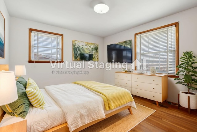 bedroom featuring wood finished floors