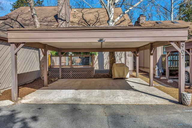 view of vehicle parking featuring a detached carport