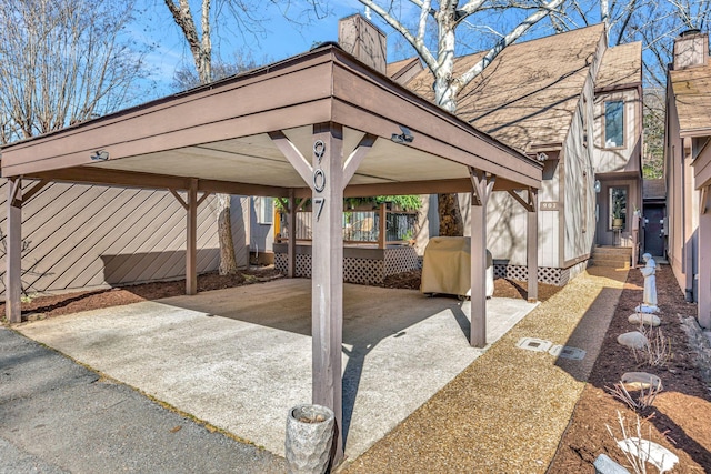 view of patio with a grill and driveway