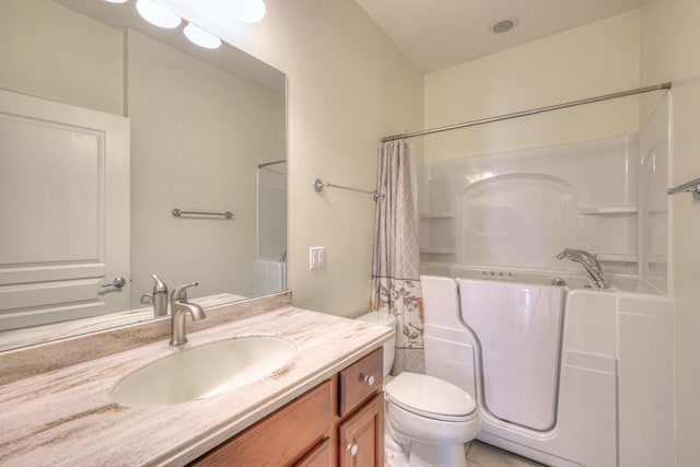 bathroom with toilet and vanity