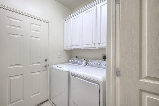 laundry room with washer and dryer and cabinet space