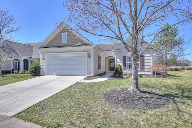 single story home featuring a front yard, driveway, a standing seam roof, a garage, and metal roof