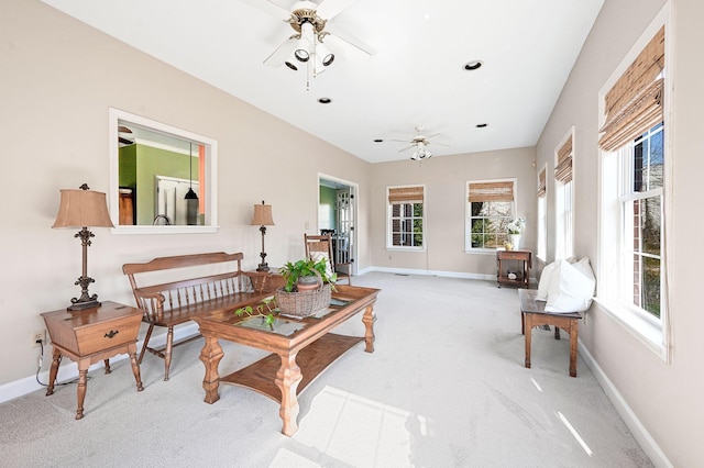 carpeted living room featuring recessed lighting, a ceiling fan, and baseboards