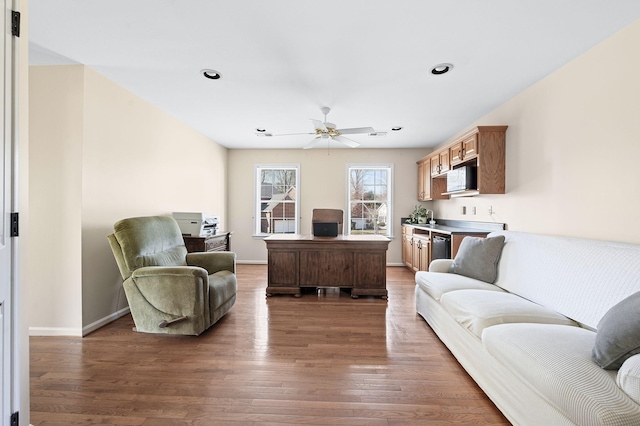 living room featuring a ceiling fan, recessed lighting, wood finished floors, and baseboards