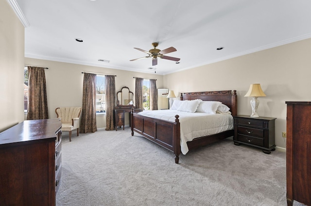 bedroom with light carpet, visible vents, and ornamental molding