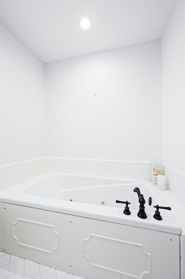 bathroom featuring recessed lighting and a whirlpool tub