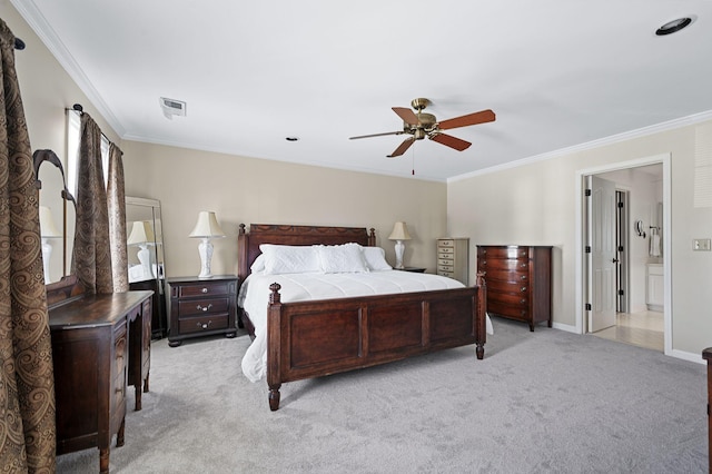 bedroom featuring visible vents, ornamental molding, baseboards, light colored carpet, and ceiling fan