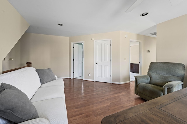 living room featuring recessed lighting, baseboards, and wood finished floors