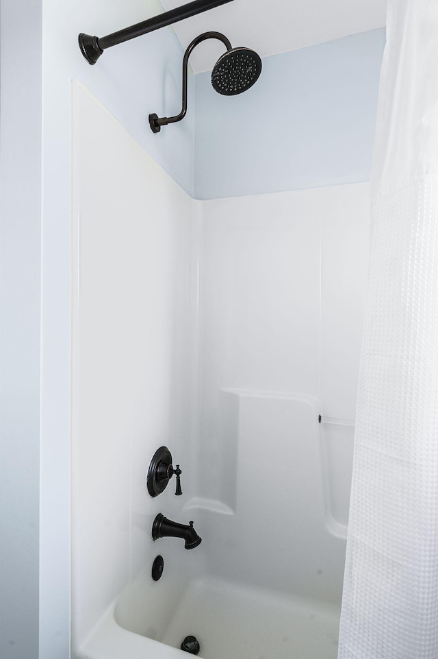 interior details with shower / bath combo