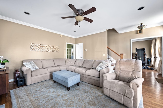 living room featuring crown molding, stairway, wood finished floors, and ceiling fan